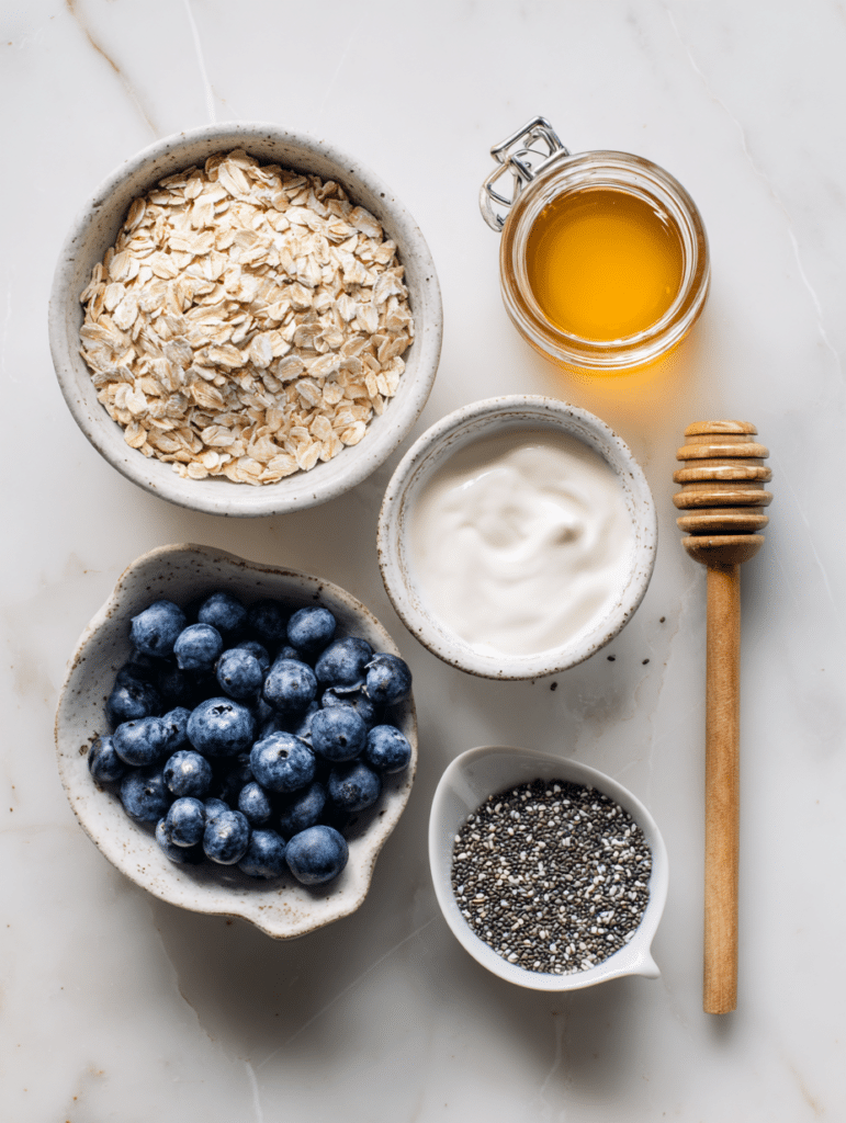 Blueberry overnight oats ingredients flat lay with oats and blueberries