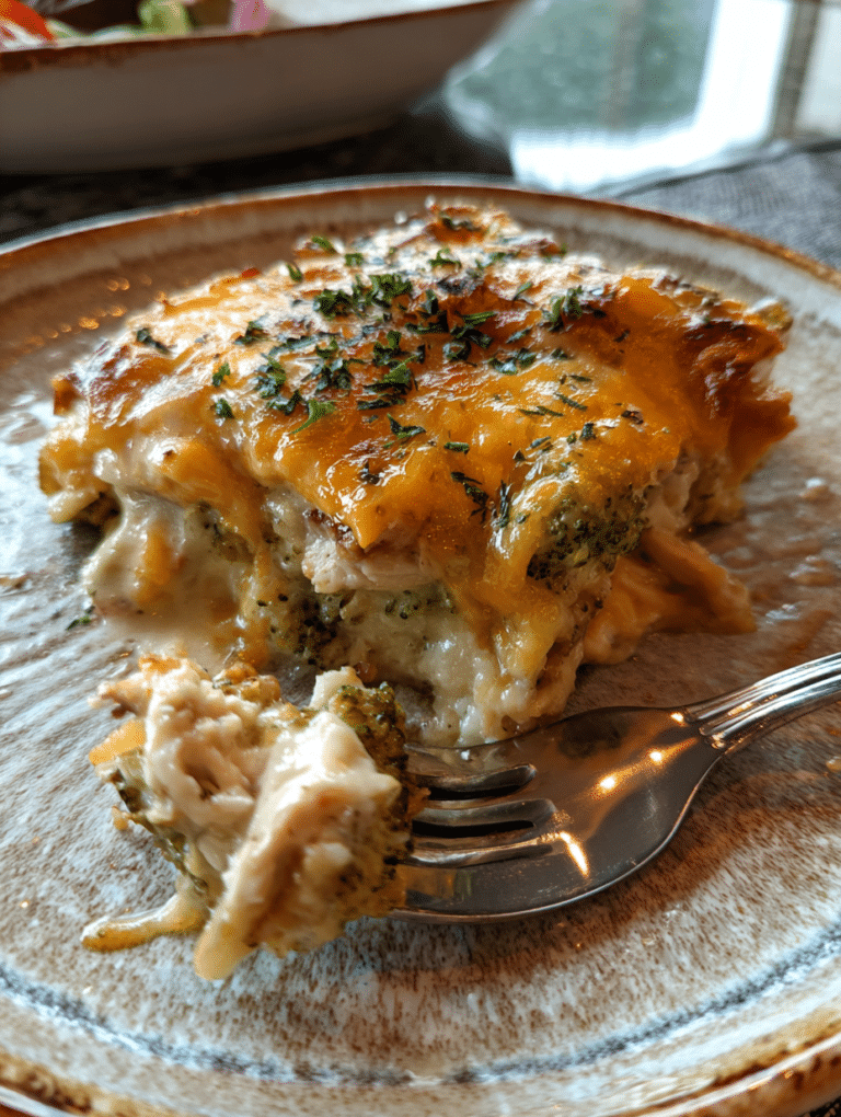Served chicken broccoli casserole on a plate with herbs